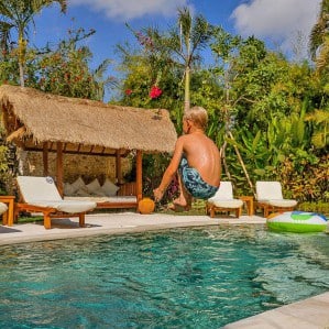 kids backflip on pool of Villa Kubu, Seminyak, Bali